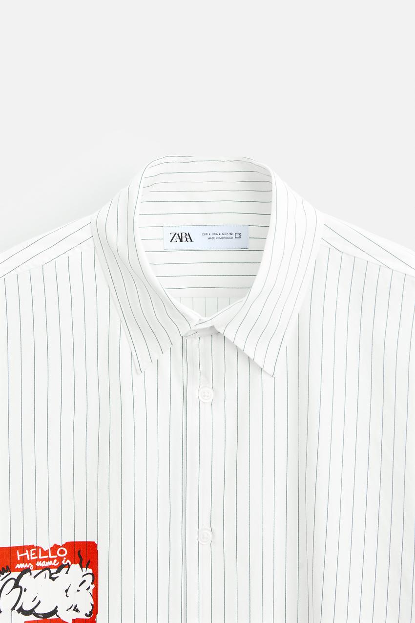 STRIPED SHIRT WITH PRINTED STICKER