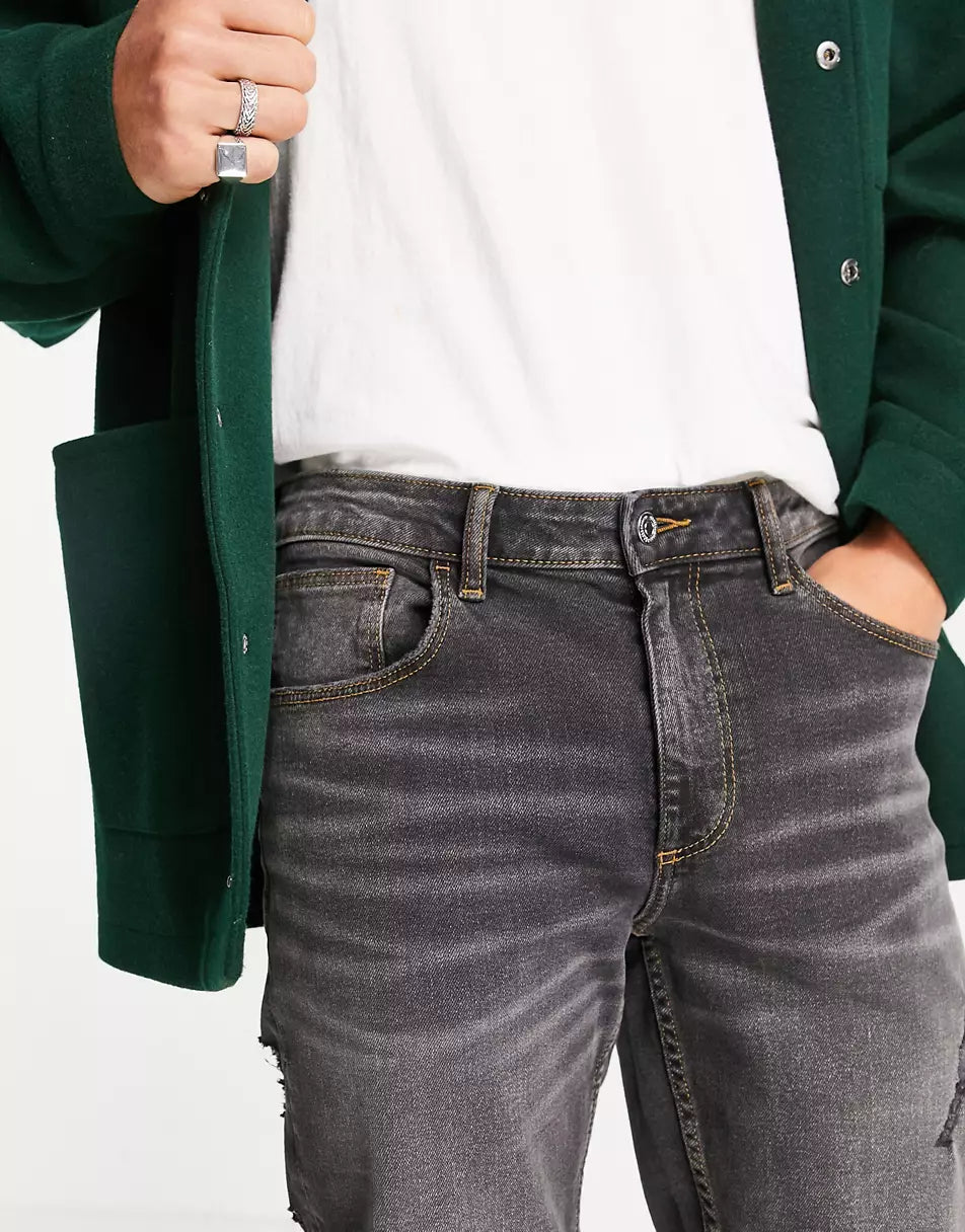 TAPERED JEANS IN WASHED BLACK WITH ABRASIONS