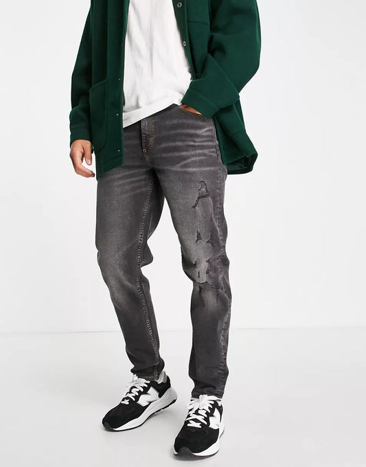 TAPERED JEANS IN WASHED BLACK WITH ABRASIONS