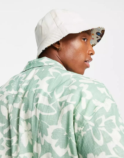 REVERSIBLE BUCKET HAT IN ABSTRACT PRINT