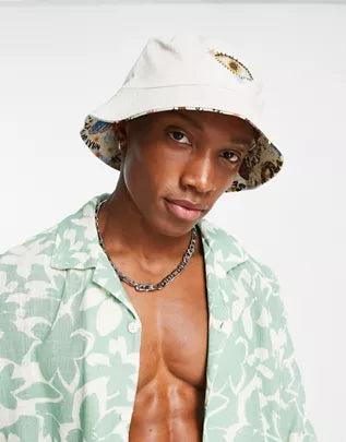 REVERSIBLE BUCKET HAT IN ABSTRACT PRINT