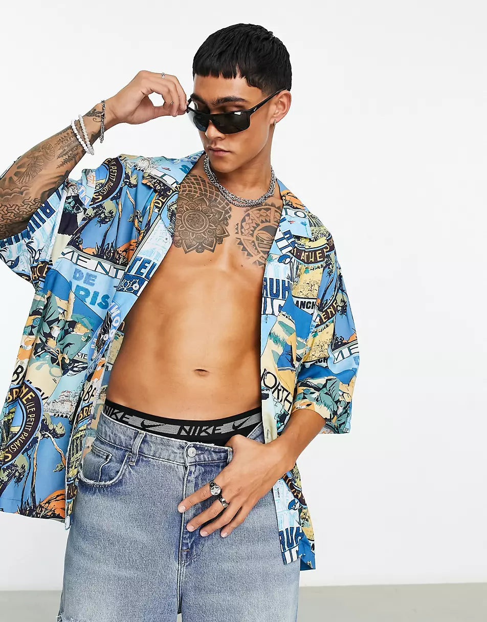 DROPPED SHOULDER OVERSIZED REVERE SHIRT IN BADGE POSTCARD PRINT