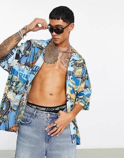 DROPPED SHOULDER OVERSIZED REVERE SHIRT IN BADGE POSTCARD PRINT
