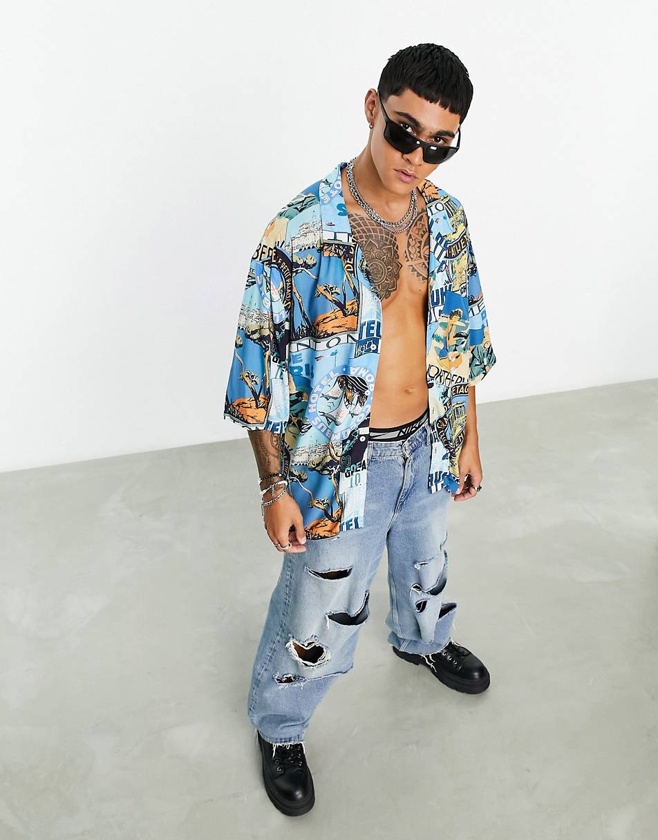 DROPPED SHOULDER OVERSIZED REVERE SHIRT IN BADGE POSTCARD PRINT