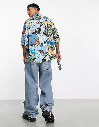 DROPPED SHOULDER OVERSIZED REVERE SHIRT IN BADGE POSTCARD PRINT