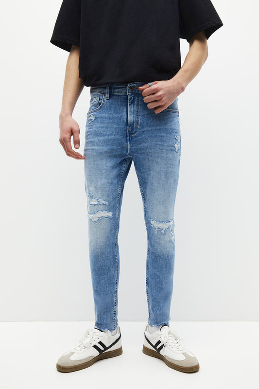 RIPPED SKINNY JEANS