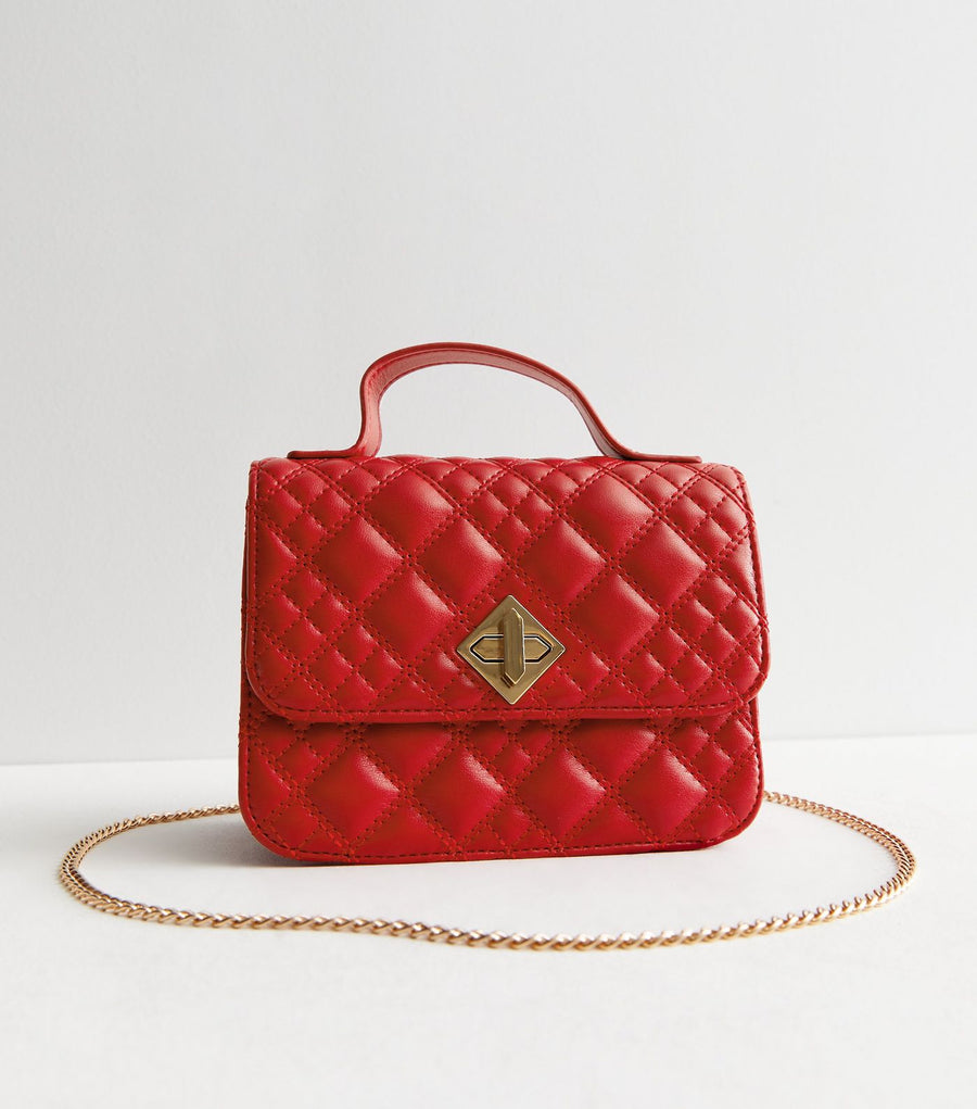 QUILTED TOP HANDLE TWIST LOCK CROSS BAG